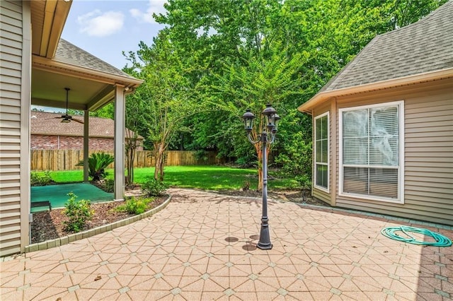 view of patio / terrace featuring ceiling fan