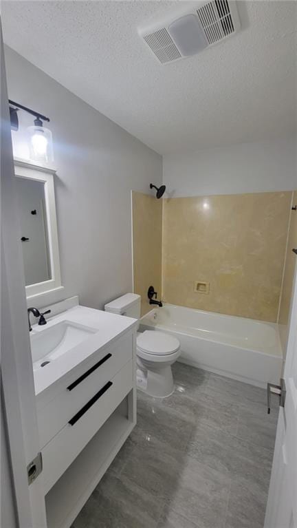 full bathroom featuring a textured ceiling, toilet, vanity, and  shower combination