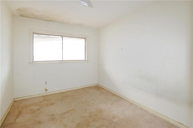 unfurnished room featuring carpet flooring