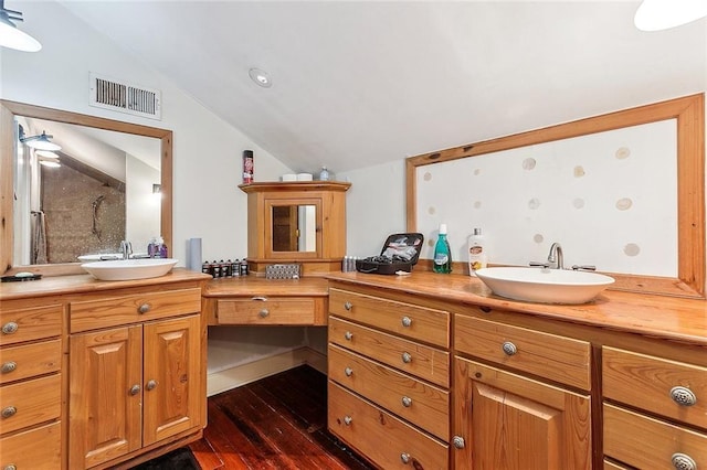 2301 Dauphine St, New Orleans, LA 70117 - bathroom featuring walk in shower, lofted ceiling, wood-type flooring, and vanity
