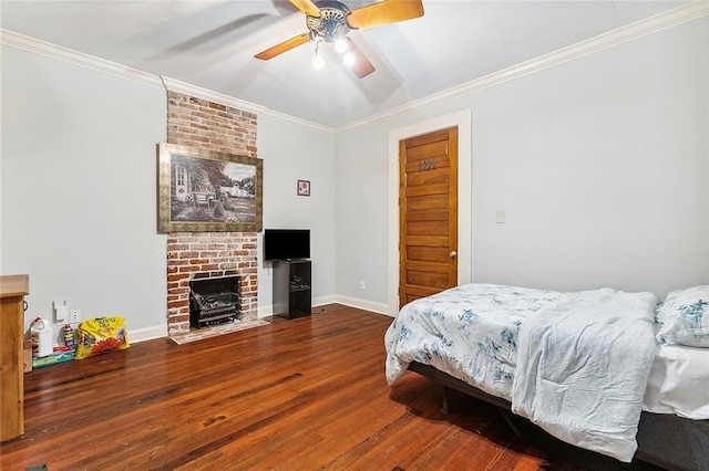 2301 Dauphine St, New Orleans, LA 70117 - bedroom with ceiling fan, ornamental molding, a brick fireplace, and wood-type flooring
