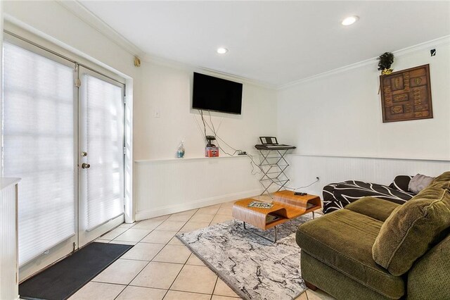 2301 Dauphine St, New Orleans, LA 70117 - living room with light tile patterned flooring, plenty of natural light, and ornamental molding