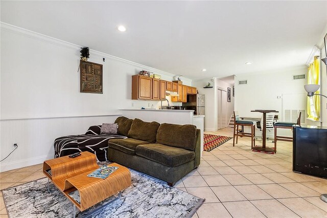 2301 Dauphine St, New Orleans, LA 70117 - tiled living room featuring sink and ornamental molding