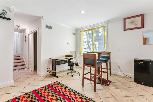2301 Dauphine St, New Orleans, LA 70117 - tiled dining room with ornamental molding