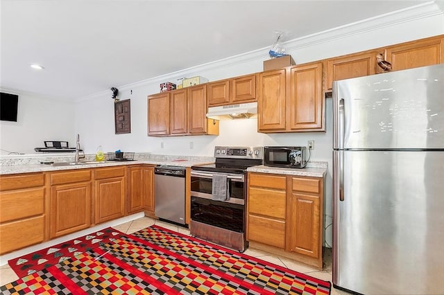 2301 Dauphine St, New Orleans, LA 70117 - kitchen with light tile patterned floors, crown molding, stainless steel appliances, and sink