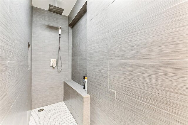 2301 Dauphine St, New Orleans, LA 70117 - bathroom featuring a tile shower