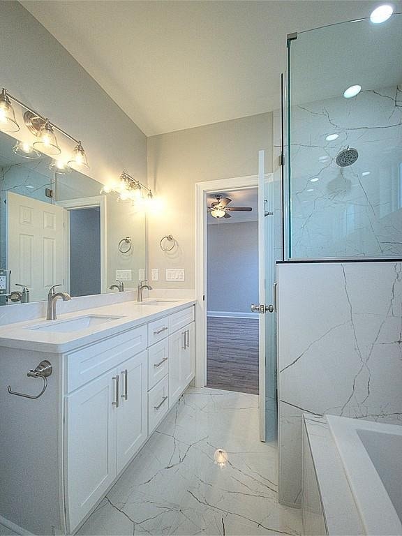 bathroom with shower with separate bathtub and vanity