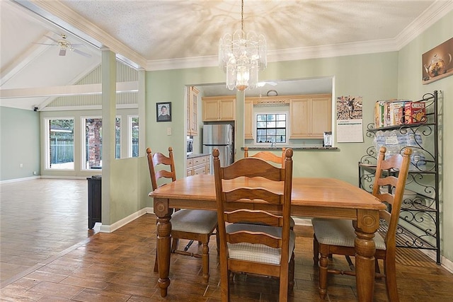 dining space with ceiling fan with notable chandelier, sink, dark hardwood / wood-style floors, and crown molding