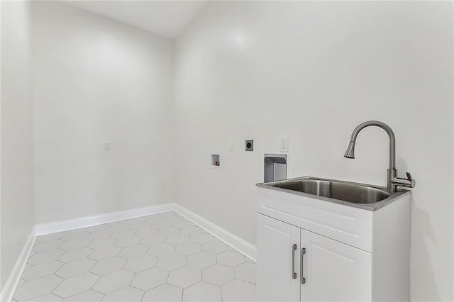 clothes washing area featuring sink, washer hookup, light tile patterned floors, hookup for an electric dryer, and cabinets