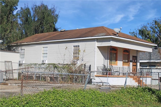 rear view of property with a porch