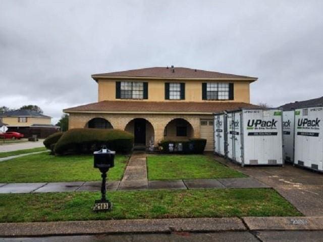 2103 Mesa Via, Harvey, LA 70058 - view of front facade featuring a front lawn