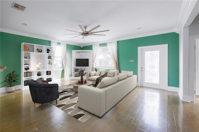 living room with ceiling fan, crown molding, and light hardwood / wood-style floors