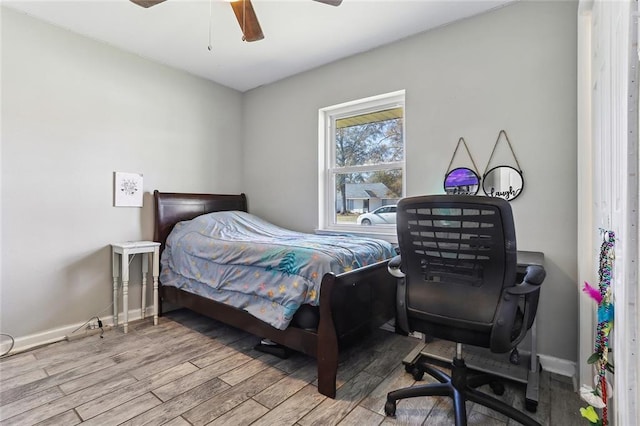 bedroom with ceiling fan and wood-type flooring