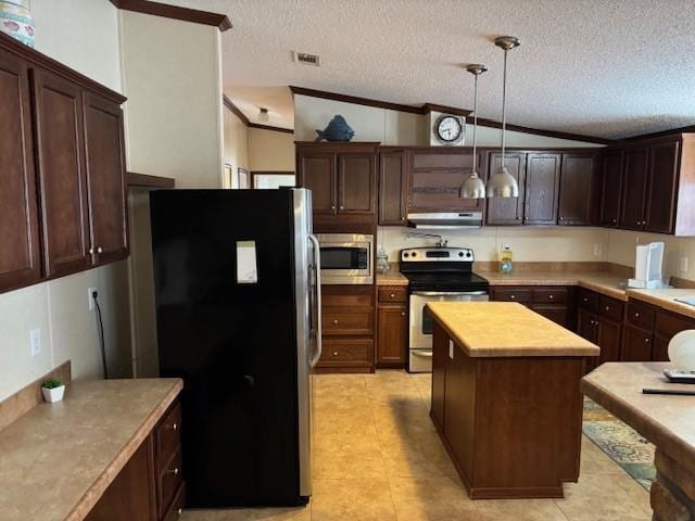 169 Pump Station Rd, Venice, LA 70091 - kitchen with lofted ceiling, appliances with stainless steel finishes, hanging light fixtures, a textured ceiling, and a kitchen island