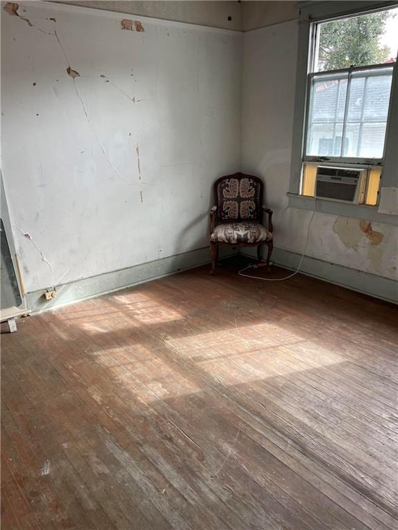 interior space with cooling unit and hardwood / wood-style floors