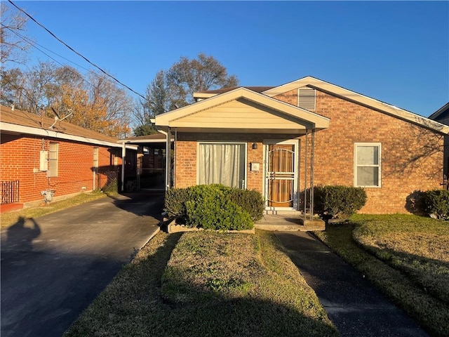 view of front of home with a carport