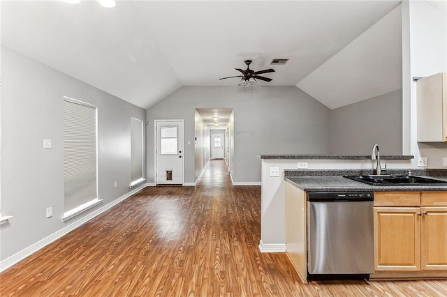 kitchen with dishwasher, wood-type flooring, sink, vaulted ceiling, and ceiling fan