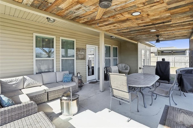 view of patio featuring grilling area, ceiling fan, and an outdoor living space