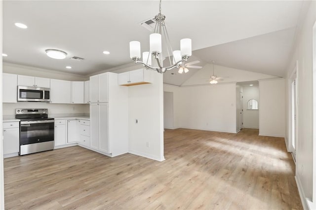 kitchen with white cabinets, stainless steel appliances, light countertops, and open floor plan