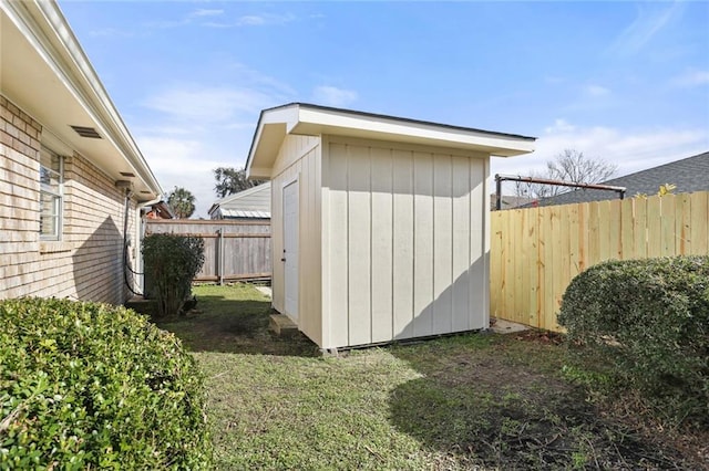 view of shed featuring a fenced backyard