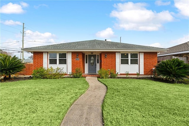 ranch-style home featuring a front yard