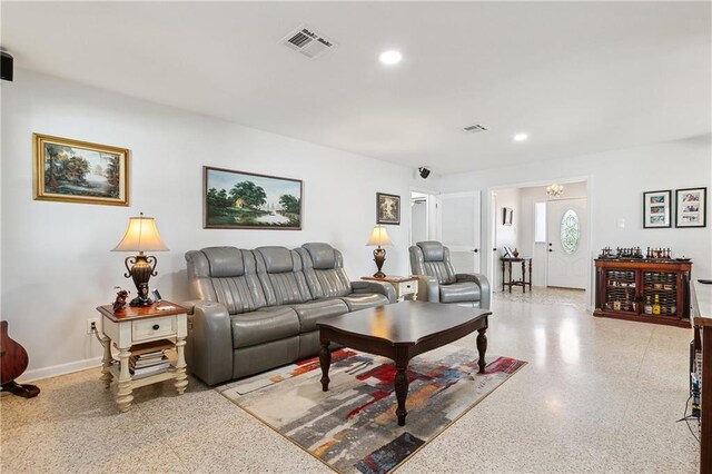 living room featuring an inviting chandelier