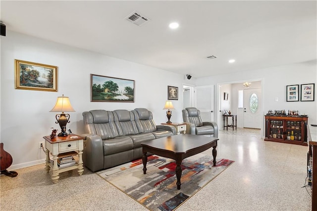 living room with an inviting chandelier