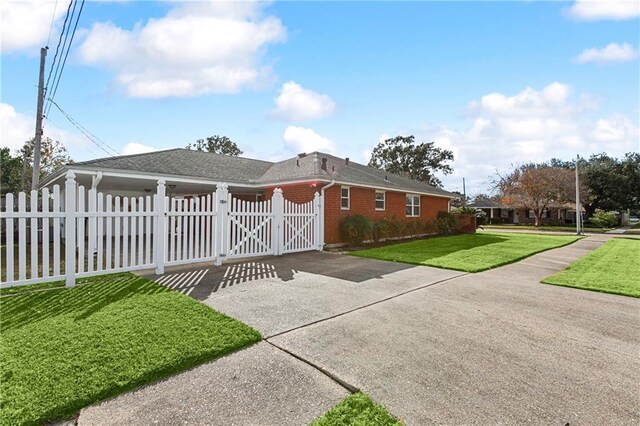 view of home's exterior with a yard