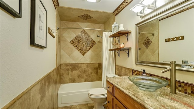 full bathroom with toilet, shower / tub combo, and vanity