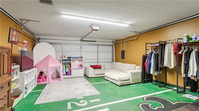 garage featuring electric panel and a garage door opener