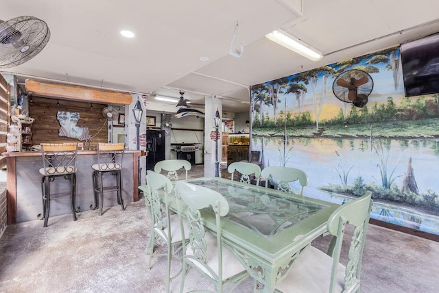 dining room featuring ceiling fan