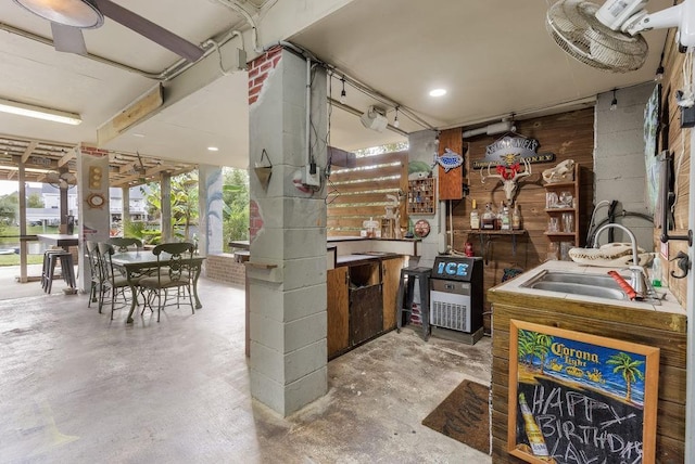 interior space featuring concrete flooring and sink