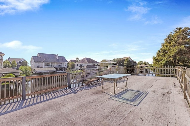 wooden terrace featuring a water view