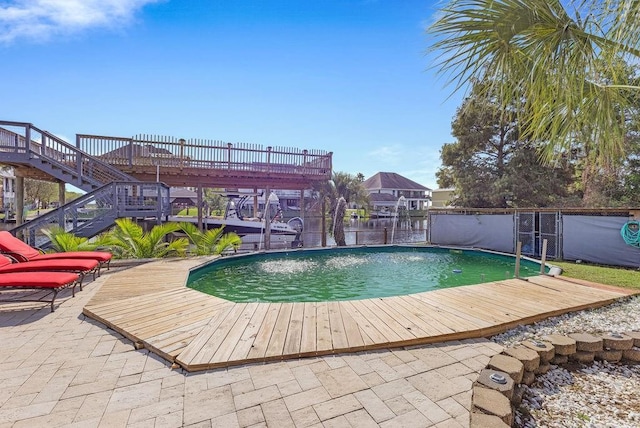 view of swimming pool with a patio area