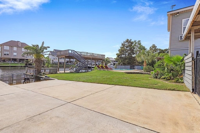 view of patio with a water view