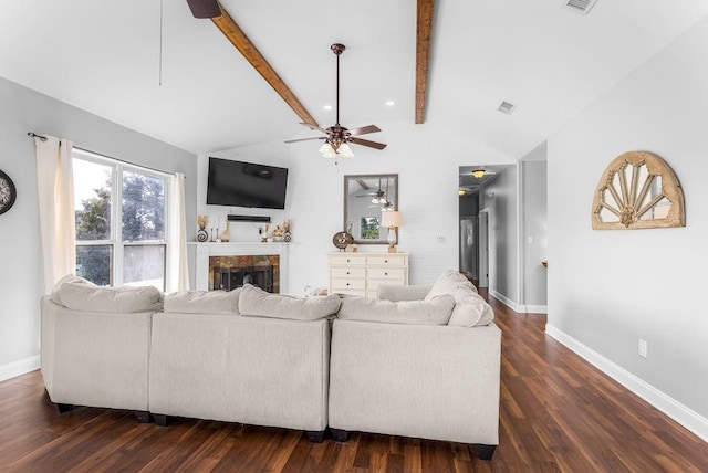 living room with vaulted ceiling with beams, dark hardwood / wood-style floors, and ceiling fan