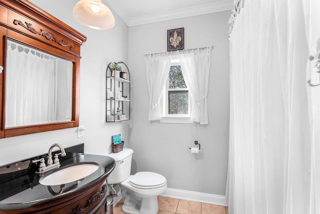 bathroom with vanity, ornamental molding, tile patterned floors, and toilet