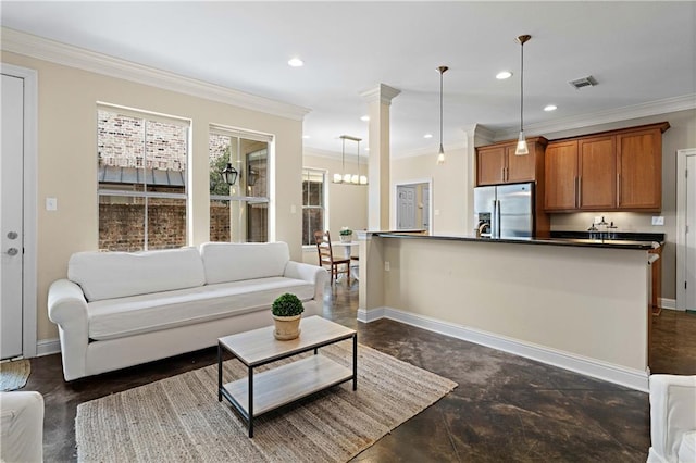 1207 Rue Degas, Mandeville, LA 70471 - living room with ornamental molding, recessed lighting, finished concrete flooring, and decorative columns