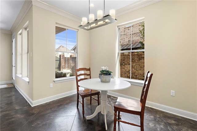 dining room with crown molding and a notable chandelier