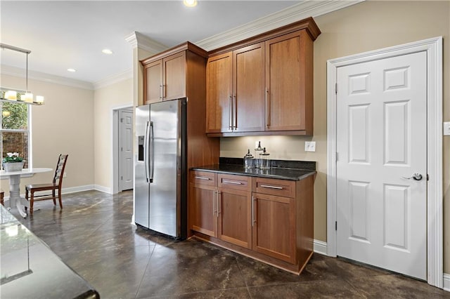 kitchen with stainless steel fridge with ice dispenser, ornamental molding, pendant lighting, an inviting chandelier, and dark stone counters