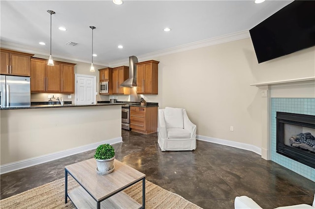 living room featuring sink, a tile fireplace, and crown molding