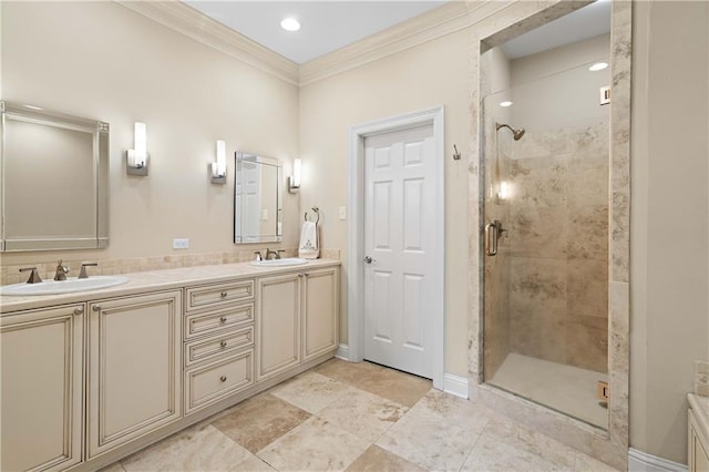 bathroom with vanity, an enclosed shower, and ornamental molding