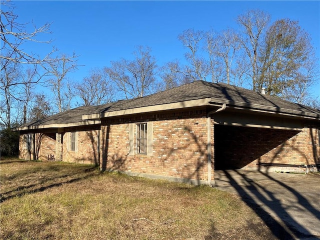 view of home's exterior with a yard