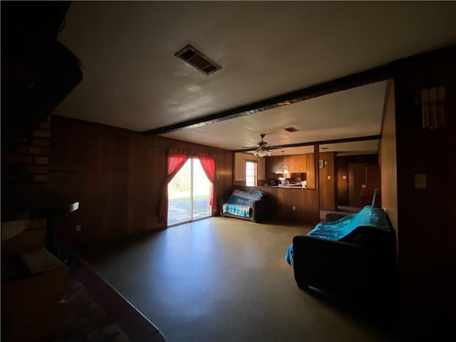 bedroom featuring access to exterior and wood walls