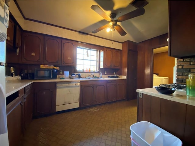 kitchen with ceiling fan, independent washer and dryer, dishwasher, and sink