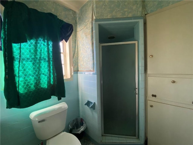 bathroom with walk in shower and toilet