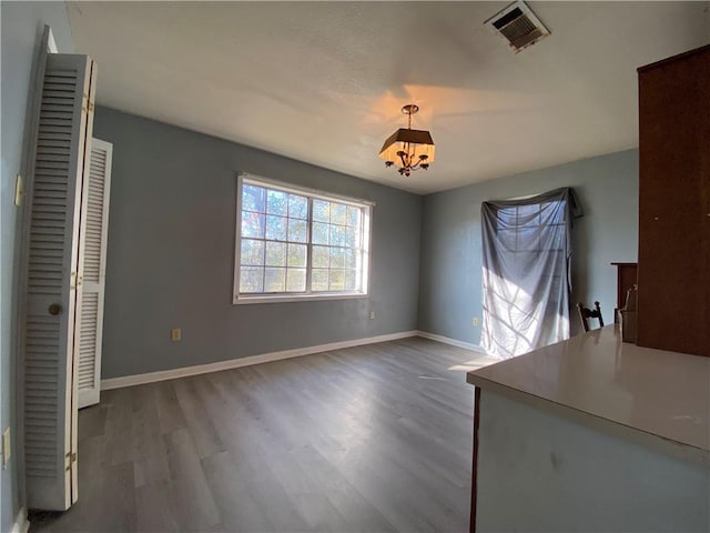 unfurnished dining area with hardwood / wood-style flooring