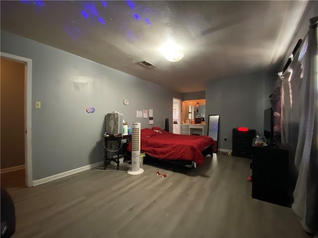 bedroom with hardwood / wood-style floors