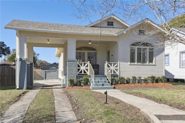 bungalow-style home featuring a porch and a front lawn