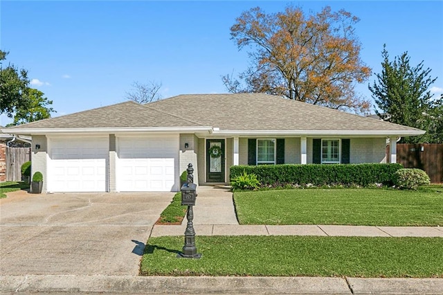 ranch-style house with a front yard and a garage